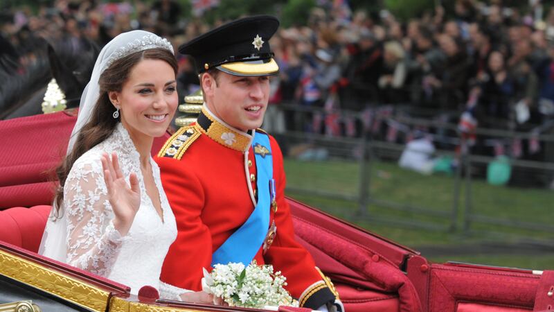Kate and William travel in the 1902 State Landau along the processional route to Buckingham Palace after their wedding