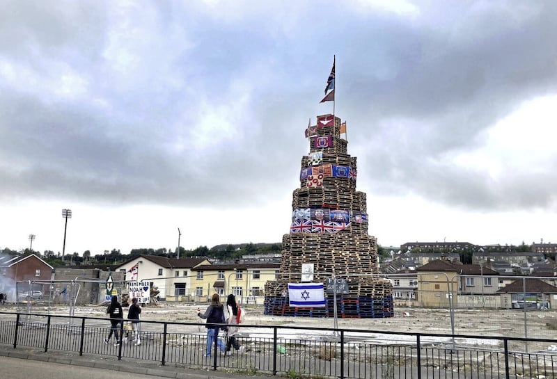 A republican bonfire on Derry's Bogside adorned with images of the queen, union flags, Parachute Regiment flags, poppy wreaths and images of a PSNI Land Rover. Picture by Margaret McLaughlin 