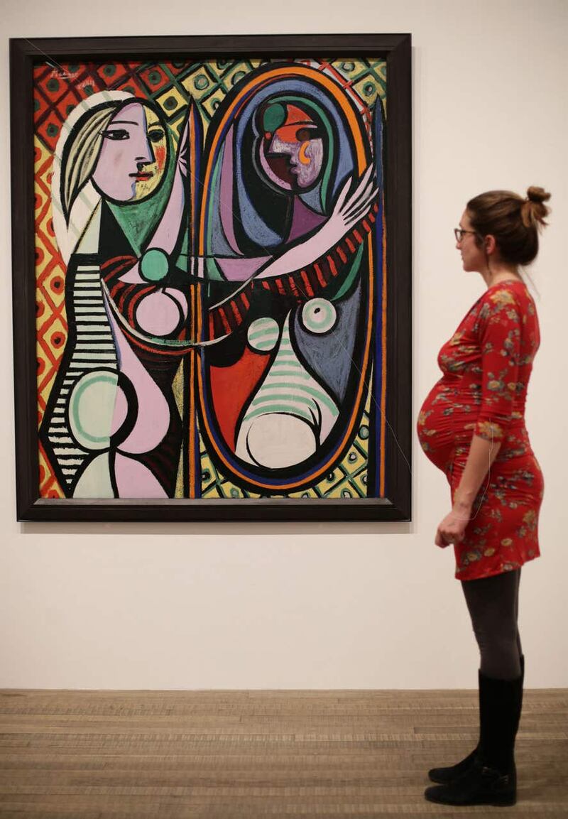 A woman looking at Pablo Picasso’s Girl before a Mirror, 1932 (Yui Mok/PA)