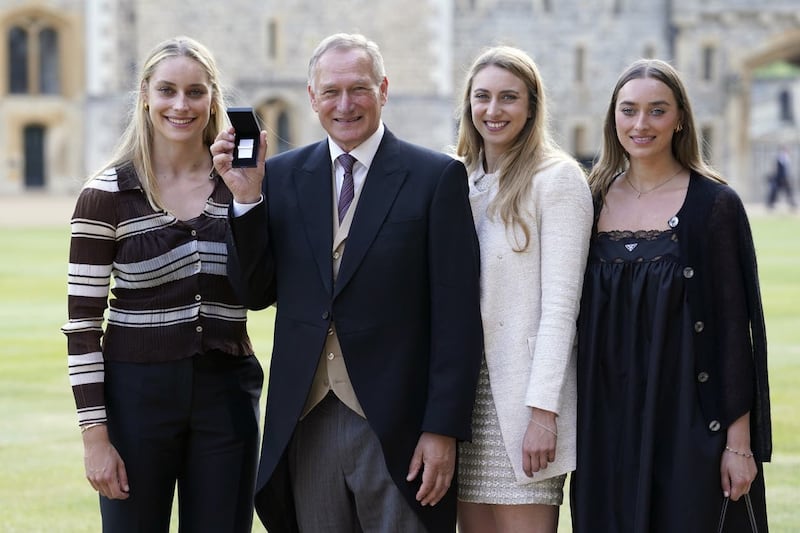 Sir David Hempleman-Adams with daughters (left to right) Alicia, Camilla and Amelia, after being awarded a Bar to the Polar Medal at Windsor Castle in 2023