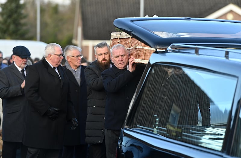 The casket of murder victim Natalie McNally is placed in to a hearse following her funeral service at her parents home in Lurgan i
