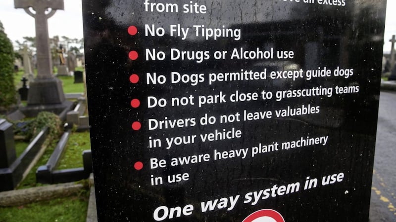 Signage erected in Milltown Cemetery informs visitors that dogs are not permitted in the grounds. Photo by Mal McCann 