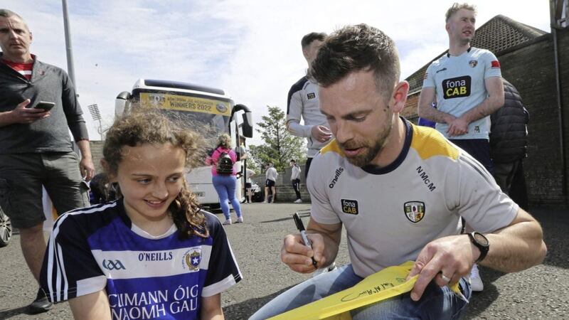 Neill McManus signs a autograph for a young fan following Antrim&#39;s Joe McDonagh title Picture by Hugh Russell. 
