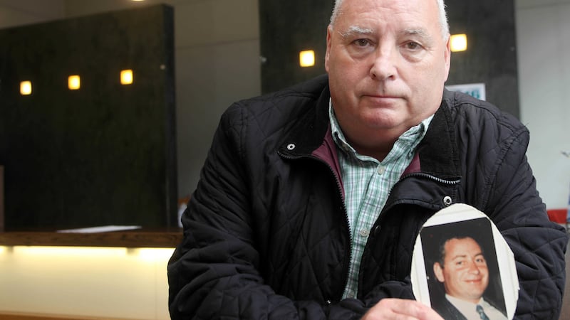 Danny Lavery holds a photograph of his murdered brother Martin. Picture by Ann McManus<br />&nbsp;