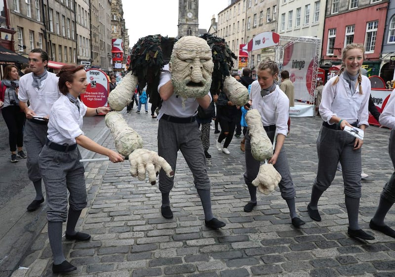 Edinburgh Fringe performers perform a scene from their production in 2017 (Andrew Milligan/PA)