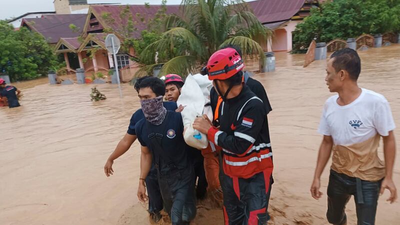 A search and rescue team worked to evacuate residents using rubber boats and other vehicles (Wajo Regional Disaster Management Agency via AP)