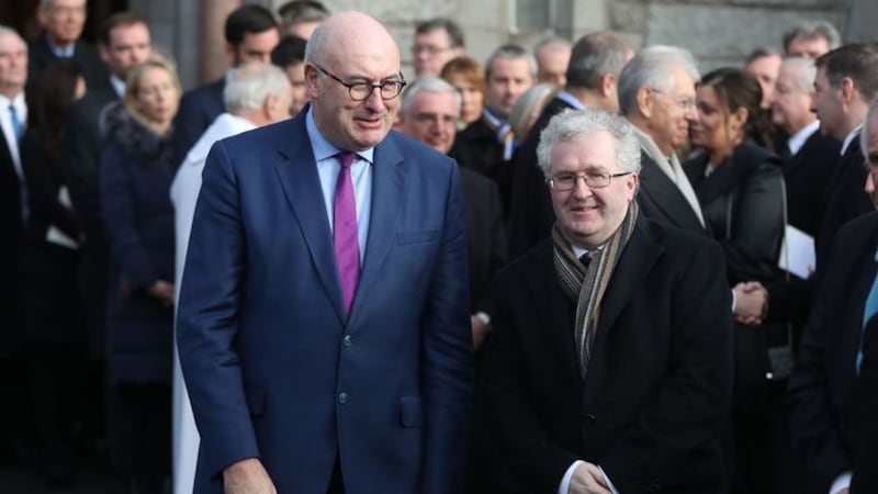 &nbsp;EU trade commissioner Phil Hogan (left) and Supreme Court judge Seamus Woulfe who both attended the Oireachtas Golf Society event two days after the Irish Government announced it intended to curb the numbers permitted to gather together.