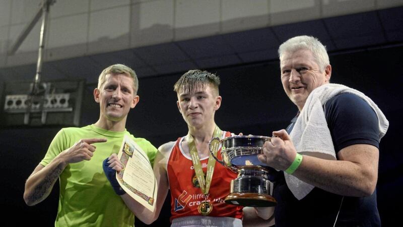 Newly-crowned Irish elite flyweight champion Jude Gallagher with coach Eric Donovan and father/coach John Gallagher after Friday night&#39;s victory over Regan Buckley. Picture by Mark Marlow 
