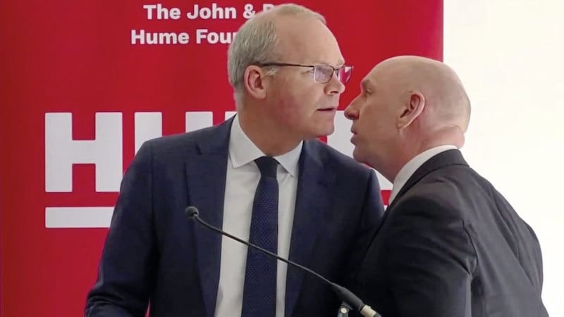 The Republic&#39;s Foreign Affairs Minister Simon Coveney is told about the security alert while speaking at the Houben Centre in north Belfast last Friday. Picture: The John and Pat Hume Foundation. 