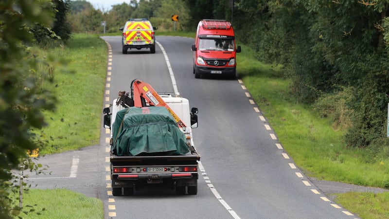The scene on the N54 Clones to Smithborough road at Legnakelly, Co Monaghan, as a vehicle is removed after two teenage pupils from Largy College in Clones were killed in a road traffic collision (Liam McBurney/PA)