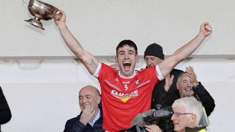 Magherafelt captain Danny Heavron lifts the cup after beating Glen during the Derry Senior Football Championship Final at Celtic Park on Sunday. Picture by Margaret McLaughlin 