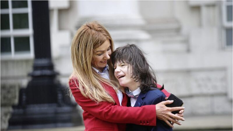 Billy Caldwell and his mother Charlotte on the way out of the High Court after an earlier hearing. Picture by Hugh Russell 