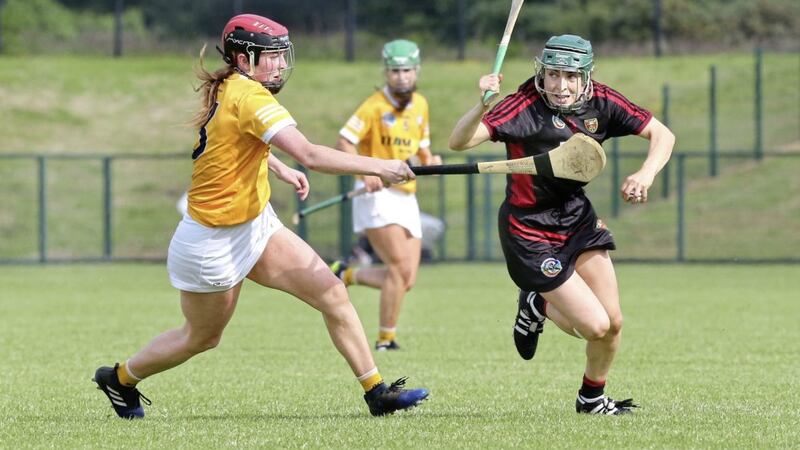 Down Niamh Mallon with Caoimhe Conlon of Antrim at Owenbeg during the National Camogie Leagues Division 2 Final on Saturday 19th June 2021. Picture Margaret McLaughlin. 