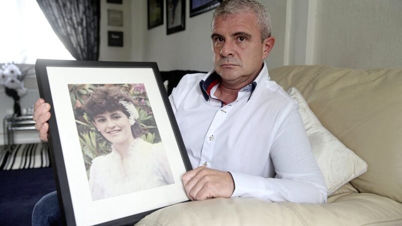 Brendan Duffy holds a photo of his teenage sister Eileen who was one of three Catholics shot dead in a mobile shop in Craigavon in 1991 Picture by Mal McCann. 
