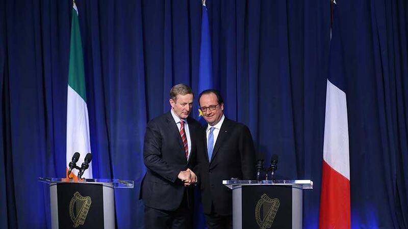 French President Francois Hollande (right) and Taoiseach Enda Kenny shake hands during a press conference at Government Buildings in Dublin. Picture by Niall Carson, Press Association&nbsp;