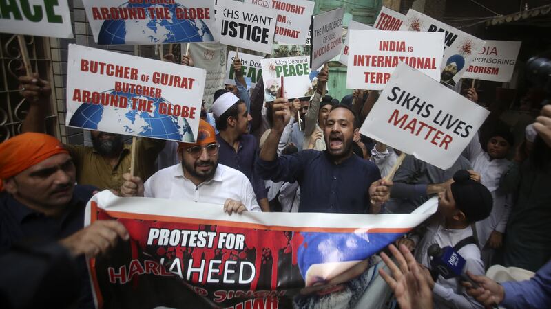 Members of the Sikh community in Peshawar, Pakistan, hold a protest against the killing of Hardeep Singh Nijjar by masked gunmen in Canada (Muhammad Sajjad/AP)