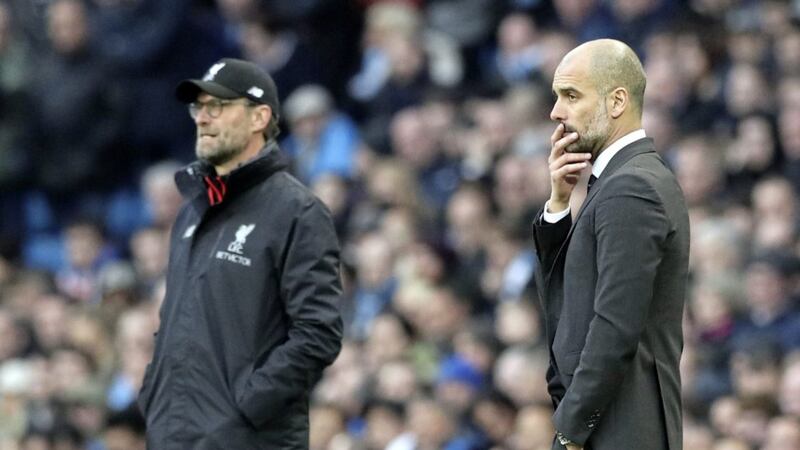 Jurgen Klopp (left) andPep Guardiola go head-to-head on Thursday in what many are billing as a title showdown 