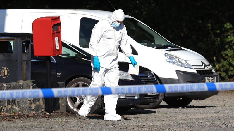 A police forensic officer at the scene following a shooting in the Ballsmill Road area of Crossmaglen (Liam McBurney/PA)