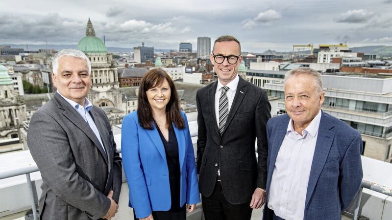 Announcing 1,000 new jobs at EY Northern Ireland is the firm&#39;s regional managing partner Rob Heron (second right) with (from left) Invest NI interim chief executive Mel Chittock, EY consulting partner Judith Savage, and Department for the Economy permanent secretary Mike Brennan 