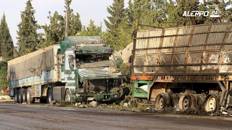 Damaged trucks carrying aid in Aleppo, Syria, on Tuesday. A UN humanitarian aid convoy in Syria was hit by airstrikes Monday as the Syrian military declared that a US-Russian brokered ceasefire had failed, and UN officials reported many dead and seriously wounded. Picture by Aleppo 24 news via Associated Press 