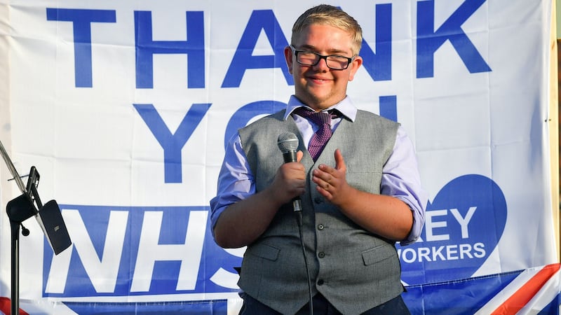 He built a stage in his garden with messages of praise for the NHS.