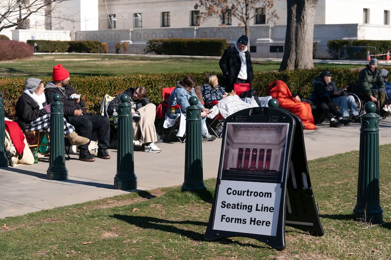 People wait in line outside the Supreme Court (Jose Luis Magana/AP)