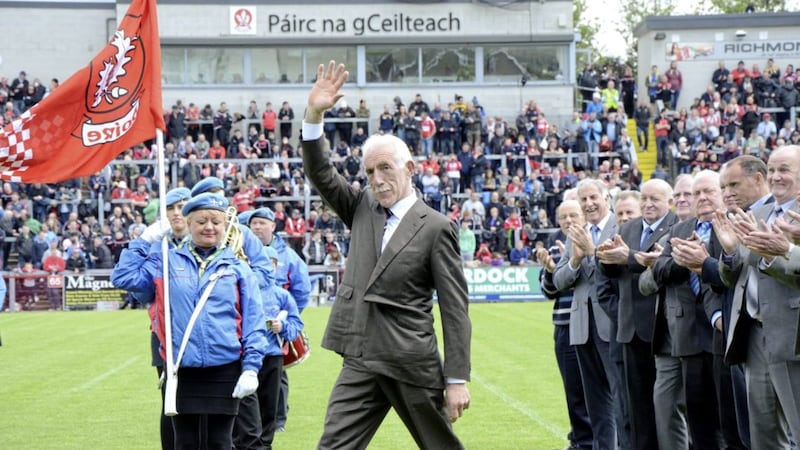 Magherafelt and Derry legend Mickey Niblock takes a step out to wave to the crowd at the Ulster championship opener in 2015 at Celtic Park. The 1965 All Ireland winning Derry minor team were recognised for their success 30 years later. Picture by Mary K Burke 