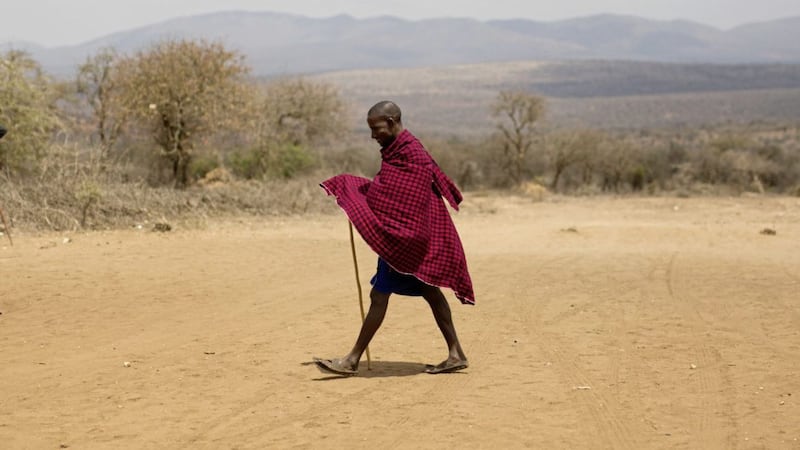 A Maasai man walks to the polling station to cast his vote in Eseki, 140 km (85miles) south of Nairobi, Kenya Picture: Jerome Delay/AP 