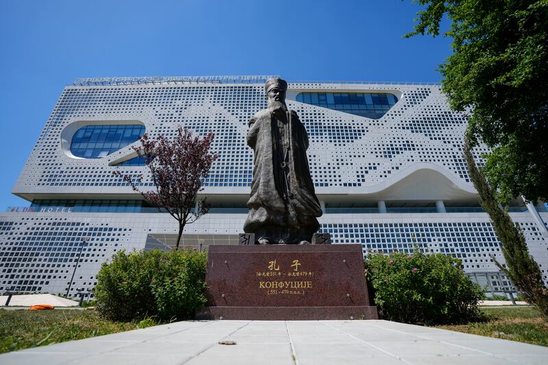 A statue of ancient Chinese philosopher Confucius stands in front of the Chinese Cultural Centre in Belgrade (Darko Vojinovic/AP)