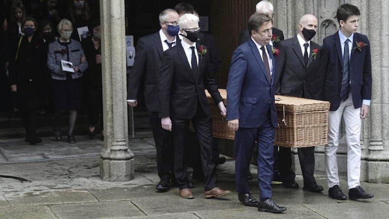 Family and friends of John Hume carrying the coffin. 