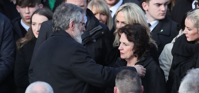 Martin McGuinness's wife Bernie is consoled by Gerry Adams as they leave St Columba's Church Long Tower, in Derry&nbsp;