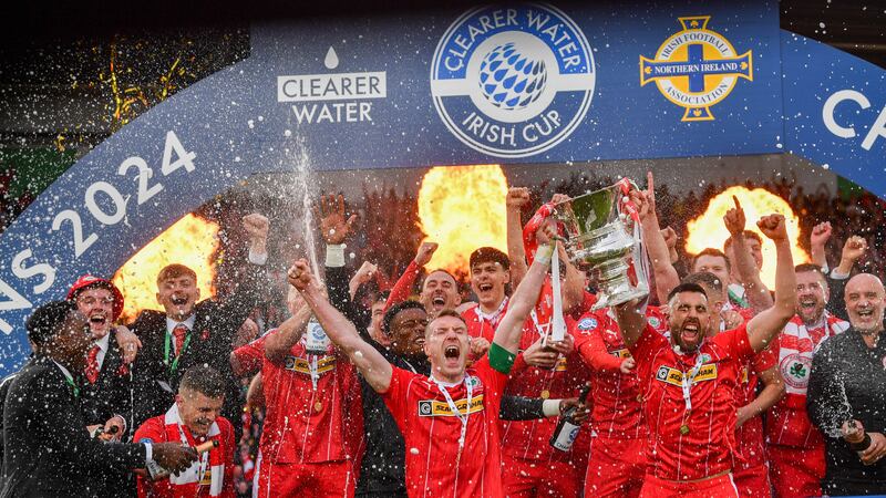 Chris Curran and Joe Gormley lift the Irish Cup Cliftonville's win over Linfield in Saturday's final at Windsor Park on Saturday
