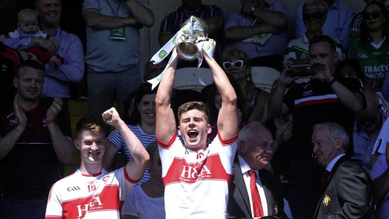 Derry captain Conor Doherty holds up the Eirgrid Ulster Under 20 Danny Murphy trophy after beating Armagh in the final at Clones yesterday. Picture by Seamus Loughran. 