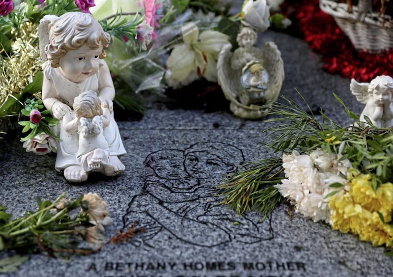 Flowers and figurines at the memorial to 222 children from the Bethany Mother and Child Home, at Mount Jerome Cemetery, Harold&#39;s Cross, Dublin. The institutions produced high levels of infant mortality, misogyny and stigmatisation of some of society&#39;s most vulnerable, the final report of an independent commission established to investigate the scandal said. Picture by Brian Lawless/PA Wire 