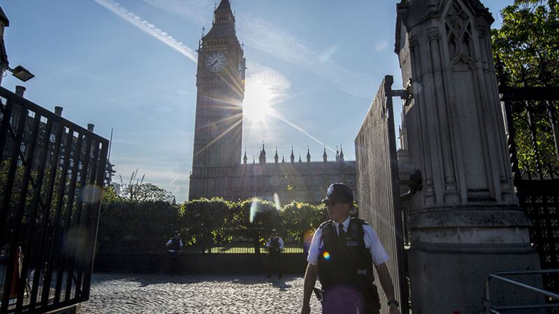 A police officer outside the Palace of Westminster in London, after Scotland Yard announced armed troops will be deployed to guard &quot;key locations&quot; such as Buckingham Palace, Downing Street, the Palace of Westminster and embassies&nbsp;