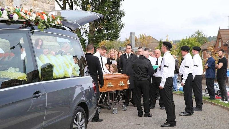 The coffin of Henry McErlean on the way to Holy Cross Church yesterday. Picture by Hugh Russell 