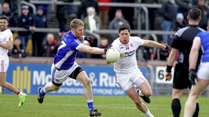 Tyrone&#39;s Sean Cavanagh comes under pressure from Cavan&#39;s Martin Reilly in the Allianz Football League clash at Healy Park on March 12 2017. Picture by Seamus Loughran. 