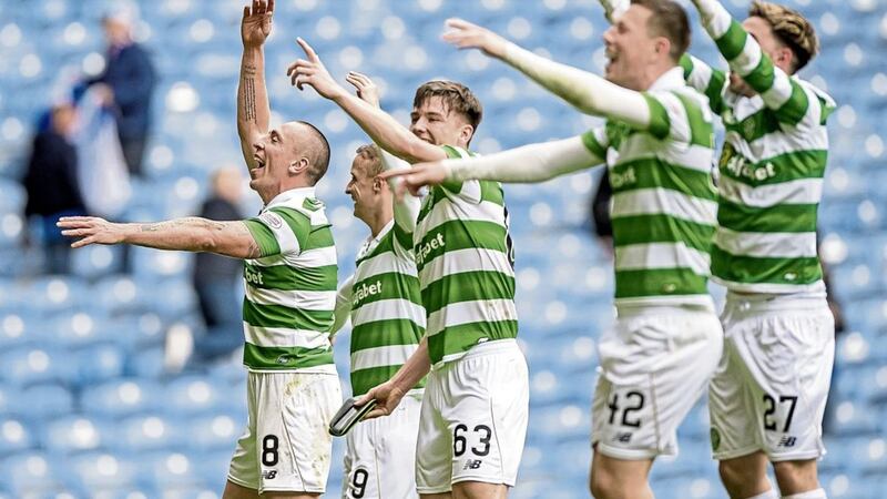 Celtic&#39;s Scott Brown (left) leads the celebrations after beating Rangers 