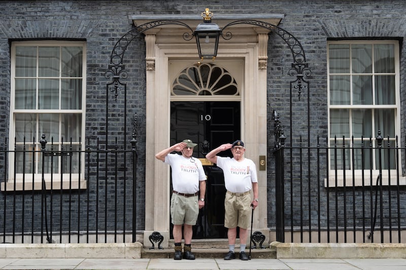 Veterans of Britain’s Cold War radiation experiments Terry Quinlan (left) and Brian Unthank (right) hand a petition in at Downing Street to formally launch proceedings against the UK Ministry of Defence