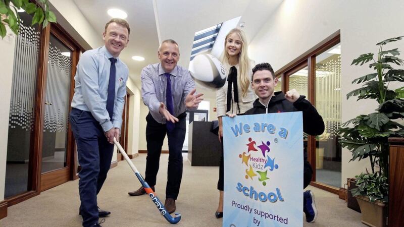 Brendan McAliskey, Director of Healthy Kidz and Jeremy Eakin, Eakin Group Director announce the new partnership with Catherine McCaughley, Marketing Executive at Healthy Kidz and Director of Coaching, Paul Carvill 