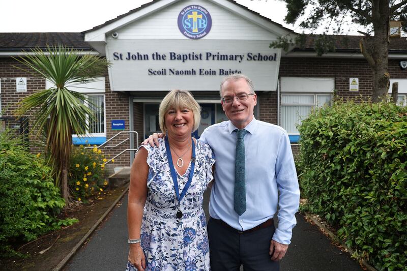 Christine Dolaghan and Chris Donnelly outside St John the Baptist PS. Picture by Mal McCann