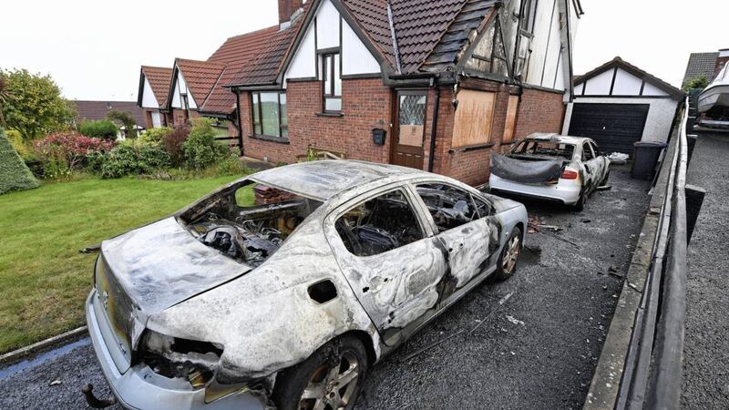 A house has been badly damaged and two cars destroyed in an arson attack in Larne, County Antrim.The two cars were set alight outside the house in Magee Park shortly after 03:00 on Sunday. The fire also damaged the house. The occupants of the house were told to stay at the back of it while firefighters put the blaze out.Picture by Justin Kernoghan.
