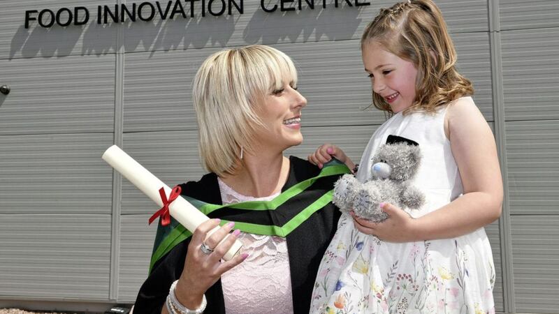 Nuala McDade from Dunmurry celebrates her graduation with her six-year-old daughter Faith at the CAFRE Loughry Campus, where she was awarded a foundation degree in food nutrition and health 