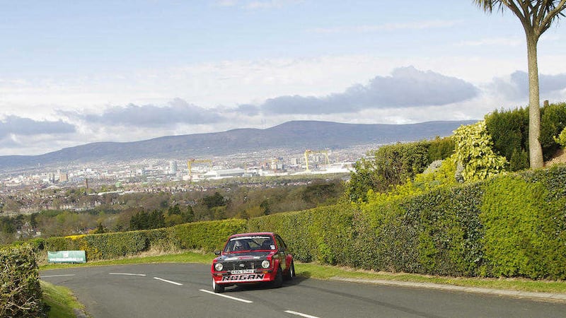 Chris Rogan from Bangor blasts up the Craigantlet Hill Climb course in Ford Escort, with Belfast as a backdrop. Picture by Tom Maxwell 