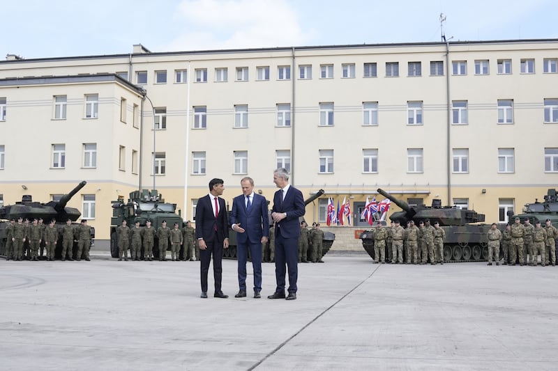 Prime Minister Rishi Sunak, Poland’s Donald Tusk and Nato’s Jens Stoltenberg at the Armoured Brigade barracks in Warsaw