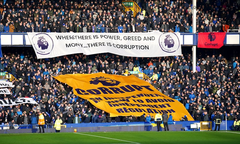 Everton fans, whose club have been docked points twice this season for breaching financial rules, protest against the Premier League