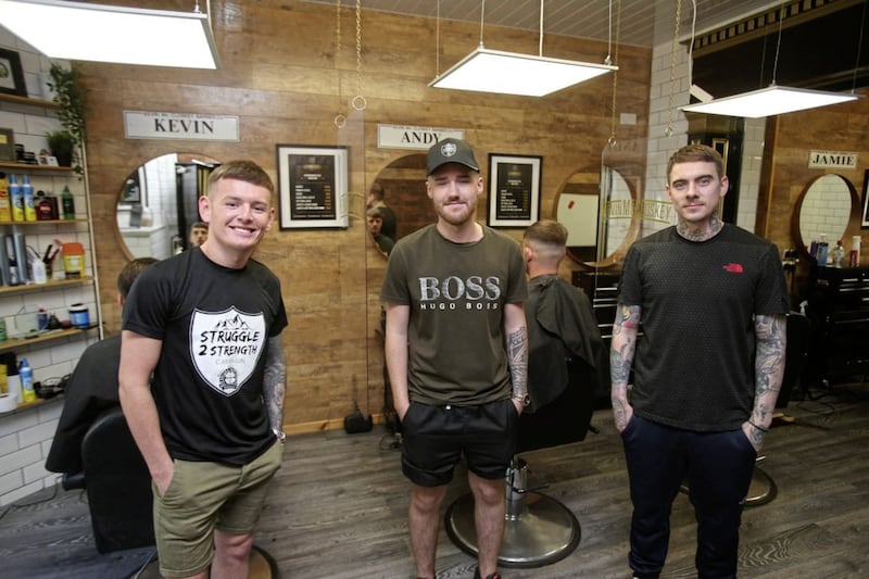 North Belfast Barber Kevin McCloskey and fellow babers Andy and Jamie are offering free haircuts to anyone struggling with mental health. Picture by Mal McCann. 