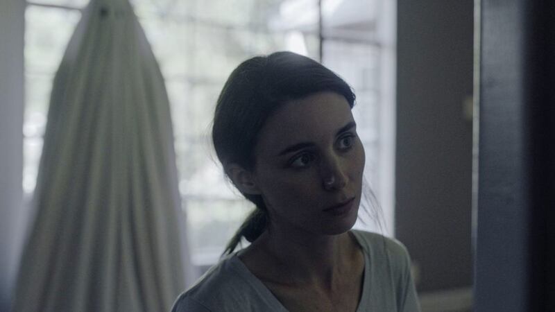 Casey Affleck as the ghost of C and Rooney Mara as M in A Ghost Story 