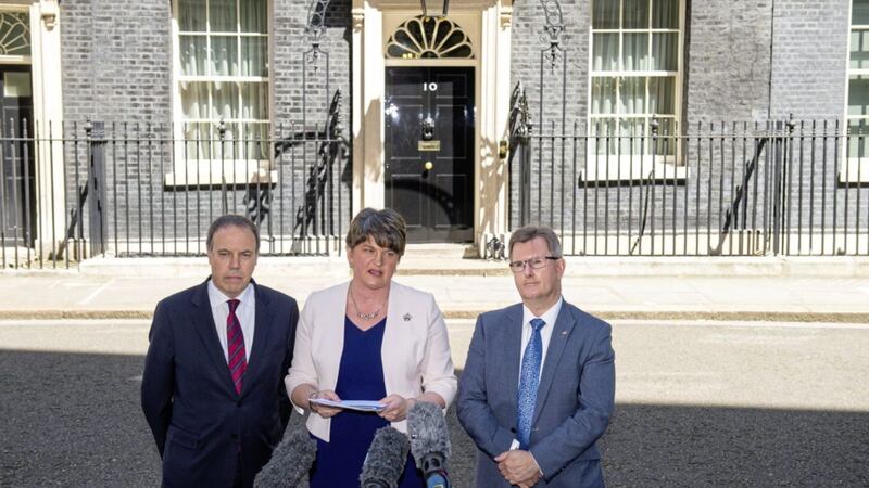DUP leader Arlene Foster, with colleagues Nigel Dodds and Sir Jeffrey Donaldson outside 10 Downing Street in London after the party agreed a deal to support the minority Conservative government. Picture by Dominic Lipinski/PA Wire 
