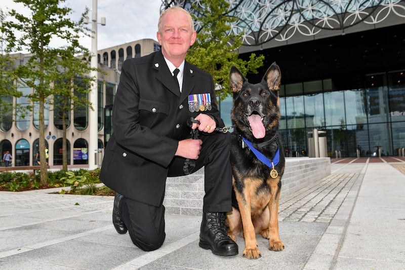 Retired West Mercia Police dog handler Pc Mike Davey and Bacca 